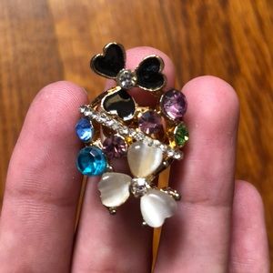 Black,cream, pink,green, blue,gold ring w diamonds